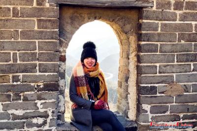 Woman visiting Beijing Great Wall Mutianyu section in winter