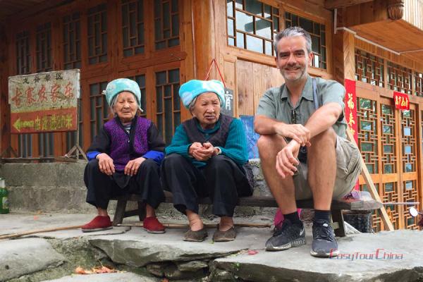 A senior traveler visit the minority people in Guilin China